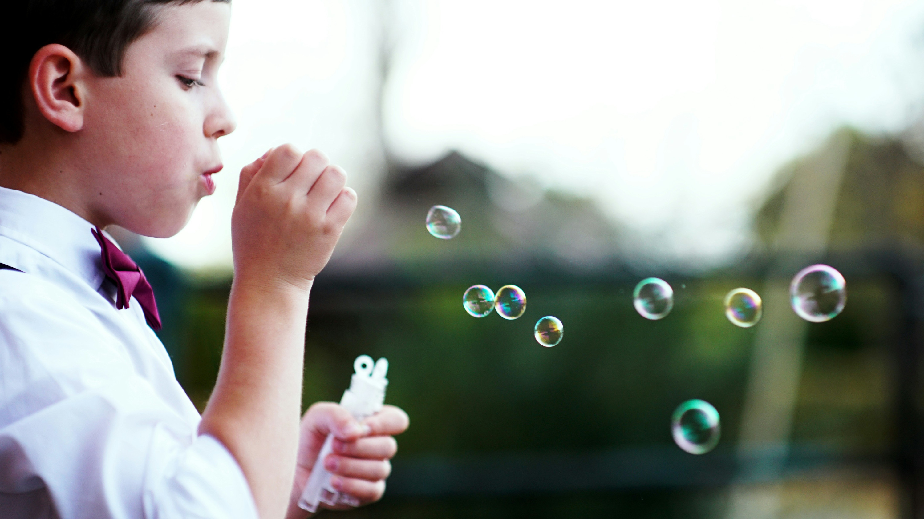 Child blowing bubbles